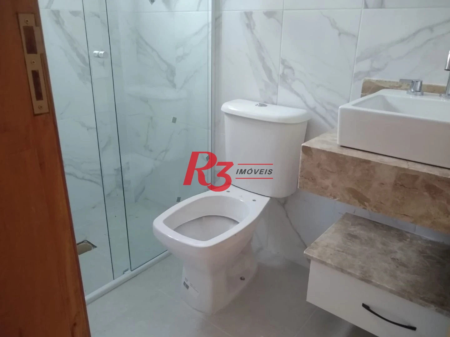 Sobrado com 3 dormitórios à venda, 100 m² por R$ 1.050.000,00 - Embaré - Santos/SP