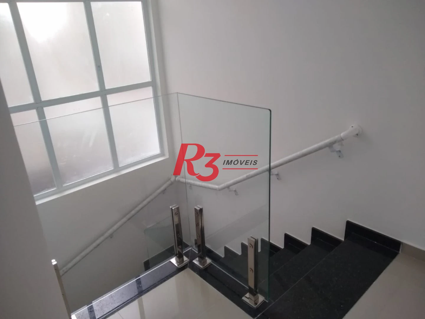 Sobrado com 3 dormitórios à venda, 100 m² por R$ 1.050.000,00 - Embaré - Santos/SP
