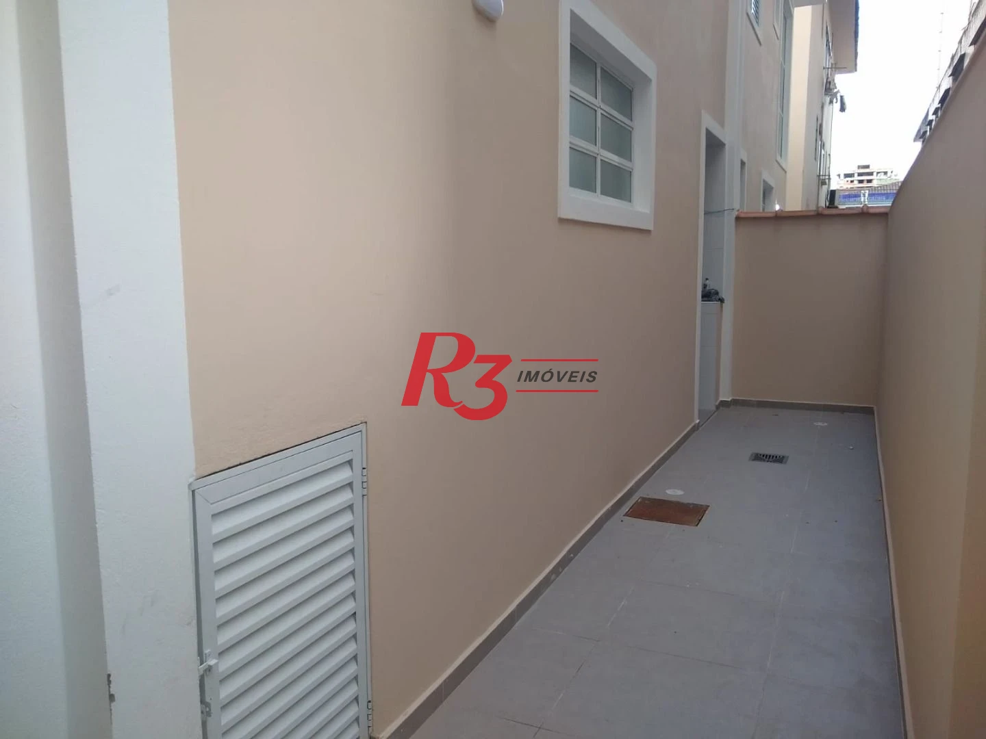 Sobrado com 3 dormitórios à venda, 100 m² por R$ 1.050.000,00 - Embaré - Santos/SP